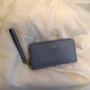 Coach light blue soft pebble wallet with wrist strap. Zipper closure,